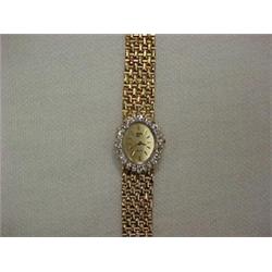 LADY'S 14K GOLD AND DIAMOND WRISTWATCH - QU