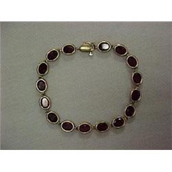 14K GOLD AND GARNET BRACELET - YELLOW GOLD