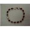 Image 1 : 14K GOLD AND GARNET BRACELET - YELLOW GOLD