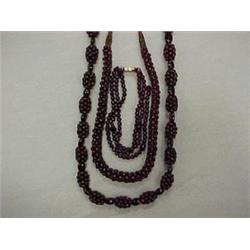 TWO GARNET NECKLACES AND A GARNET BRACELET