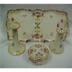 FOUR PIECE PORCELAIN DRESSER SET