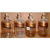 Image 1 : Four C19th glass stoppered chemist bottles with original gilt lettering