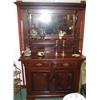 Image 1 : A C19th mahogany mirror backed dresser with two drawers over two doors with carved detail to doors a