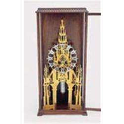 A Gothic tracery lancet skeleton timepiece, the eight day single-train movement with anchor escapeme