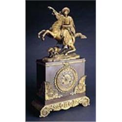 A mid 19th century French Empire-style bronze and gilt-metal-mounted mantel clock, the eight day two