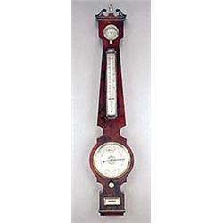 A mid 19th century mahogany wheel barometer, with silvered dial, hygrometer, thermometer, and spirit