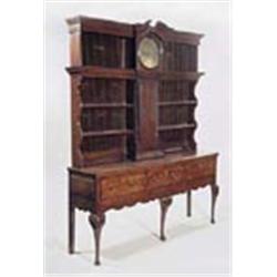 An oak dresser with an integral longcase clock by Winstanley, Ashburn; the clock with an eight-day f