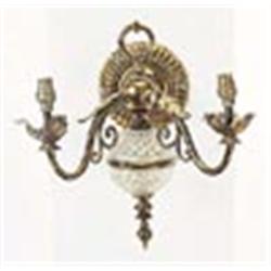 A pair of gilt brass wall lights, each applied with leaves, with two scrolling branches and a cut gl