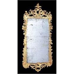 A mid 18th century giltwood mirror, the rectangular bevelled plate with a leaf, flower and scroll ca