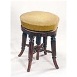 A William IV mahogany round piano stool, the padded adjustable seat on reeded splayed legs, 47-64cm