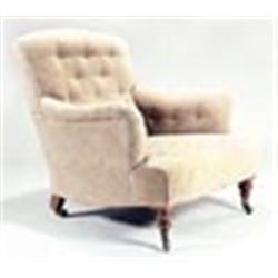 A Howard & Sons armchair, upholstered in pale moquette with a buttoned back and sides, on mahogany t