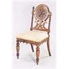 Image 1 : A Victorian oak hall chair, the round back carved with  three fish on turned supports with lobed fin