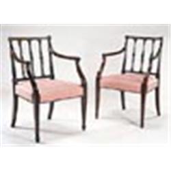 A pair of late George III mahogany elbow chairs, each with leaf and flower carved slats, a moulded f