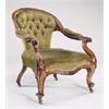 Image 1 : A Victorian rosewood open armchair, the crest carved with flower heads, with padded back, arms and s