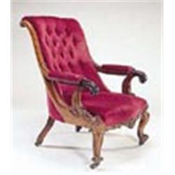 A Victorian mahogany open armchair, with scrolled button back, padded arms and seat on shell and scr