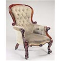 A Victorian mahogany show frame armchair, with padded back arms and seat, on cabriole legs with bras