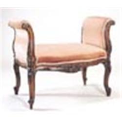 A mid 19th century walnut window seat with upholstered scroll ends and seat, the frame carved to bot