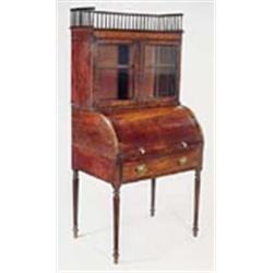 A George IV mahogany and ebony strung cylinder desk, the raised back with a three-quarter spindle ga