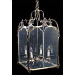 A brass hall lantern, the four branches within glazed and arched sides with cartouche crests, suspen