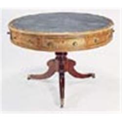 A George IV mahogany drum top library table, crossbanded and with a gilt tooled leather inset, above