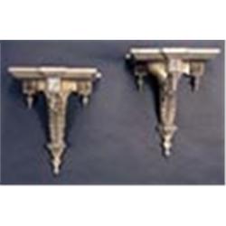 A pair of 19th century gilt painted wood and gesso wall brackets in neoclassical style, with turned