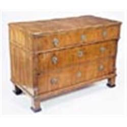 An early 19th century Scandinavian walnut commode, with three long drawers, the upper drawer outset,