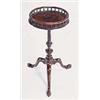 Image 1 : A George III mahogany kettle stand, the round top with a turned spindle gallery, on a spirally flute