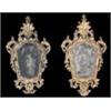 Image 1 : A pair of mid 18th century Italian giltwood wall mirrors of cartouche form, each with a shell crest,