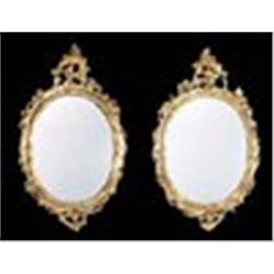 A pair of late 18th century giltwood wall mirrors, each mahogany frame with an acanthus crest and sc