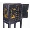 Image 1 : An early 19th century japanned cabinet on later stand, the cabinet painted with figures in oriental