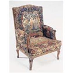 A Louis XV walnut armchair, the seat, back and arms covered in 18th century gros and petit point nee