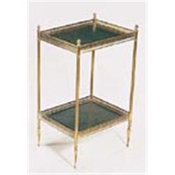 A French brass two tier table, with turned finials, pierced galleries and leather insets with reeded