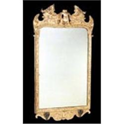 A giltwood wall mirror, the frame carved with foliate scrolls and strapwork, with two brackets for c