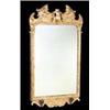 A giltwood wall mirror, the frame carved with foliate scrolls and strapwork, with two brackets for c