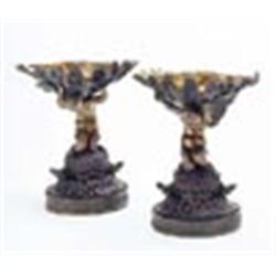 A pair of 19th century French parcel gilt bronze tazze, each in the form of a kneeling mermaid holdi