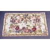 A mid 19th century needlework rug woven with a bold design of lilies, irises and  roses and other fl