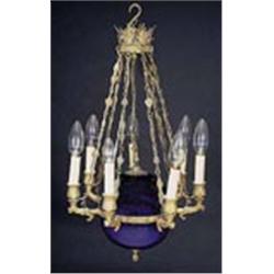 A 19th century Continental gilt metal seven light chandelier,with anthemion crest, stiff leaf and ro