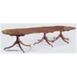 An early 19th century mahogany 'D' end triple pedestal dining table, the top with a reeded edge and