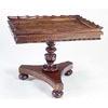 Image 1 : A George IV rosewood table, the rectangular top with a scroll carved gallery and nulled border on a