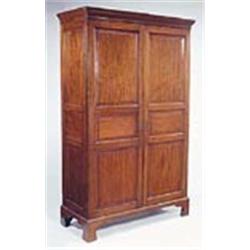 A 19th century mahogany wardrobe, the moulded concave cornice above two triple panelled doors, on br