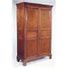 A 19th century mahogany wardrobe, the moulded concave cornice above two triple panelled doors, on br