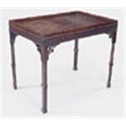 A mahogany rectangular silver table in George III style, with a wavy gallery, blind fret frieze and
