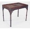 A mahogany rectangular silver table in George III style, with a wavy gallery, blind fret frieze and