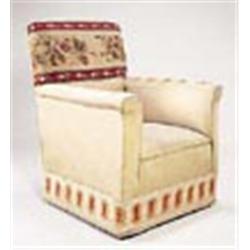 An early 20th century armchair upholstered with woolwork panels and pale green silk, on square taper