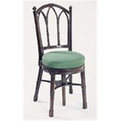 A late George III mahogany music stool, the back with leaf carved finials and pierced gothic arches,