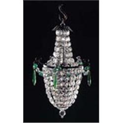 A cut glass basket shaped light fitting with graduated facetted drops and a spherical finial, with g