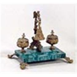 A 19th century malachite rectangular inkstand, with a gilt bronze bell, on a scroll and bird cast st