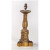 A French Empire ormolu candle stand stamped by Thomire, the reeded round drip pan above a stiff leaf