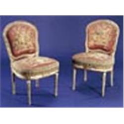 A set of eight mid 19th century French chairs in Louis XVI style, the white painted and parcel gilt