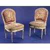 Image 1 : A set of eight mid 19th century French chairs in Louis XVI style, the white painted and parcel gilt